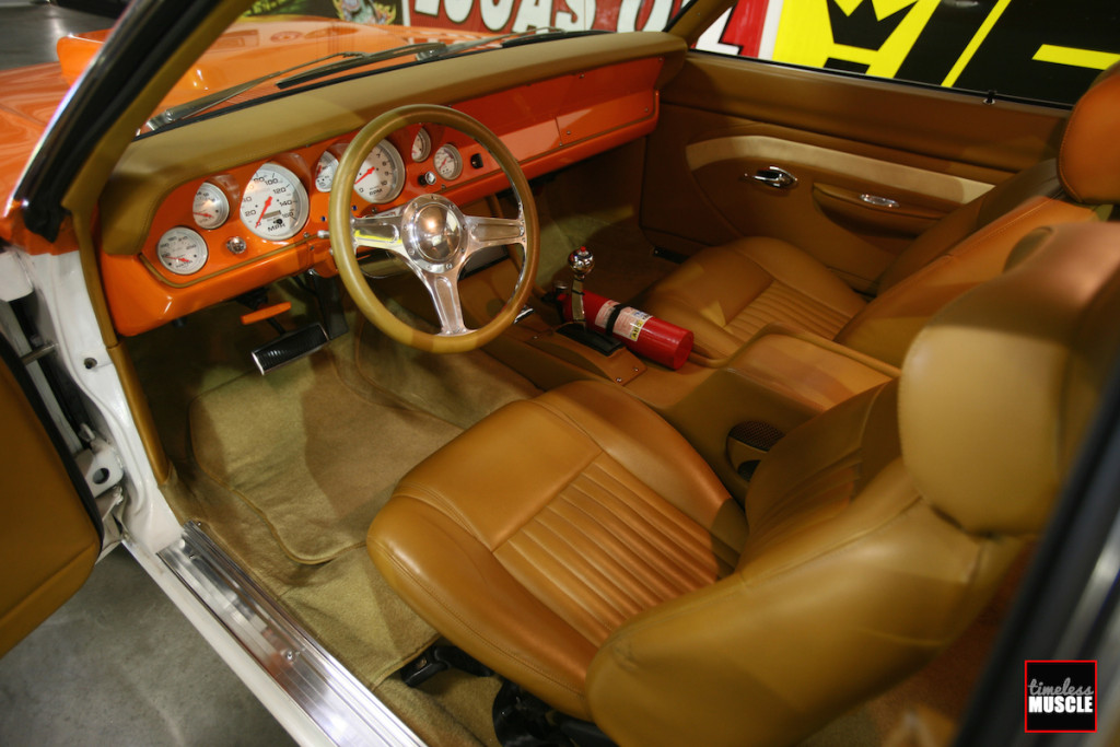 Step into the lounge. Dodge never made a Demon this plush. Leather abounds from the mini van-sourced front seats to the custom made door panels. Lokar door handles and pulls finish the custom look.